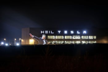 Heil Tesla projected on side of German factory