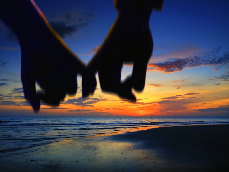 Holding hands at the beach