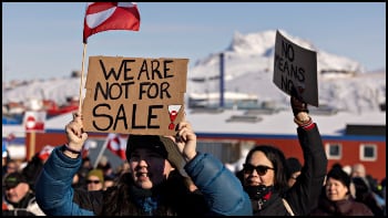Protesters in Greenland hold up We are not for sale signs