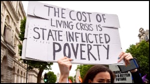 Protester holds up sign 
