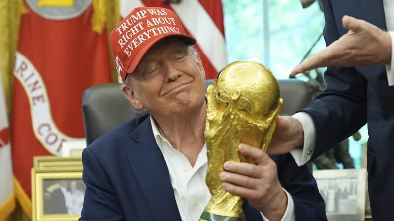 Trump holds FIFA trophy in Oval Office