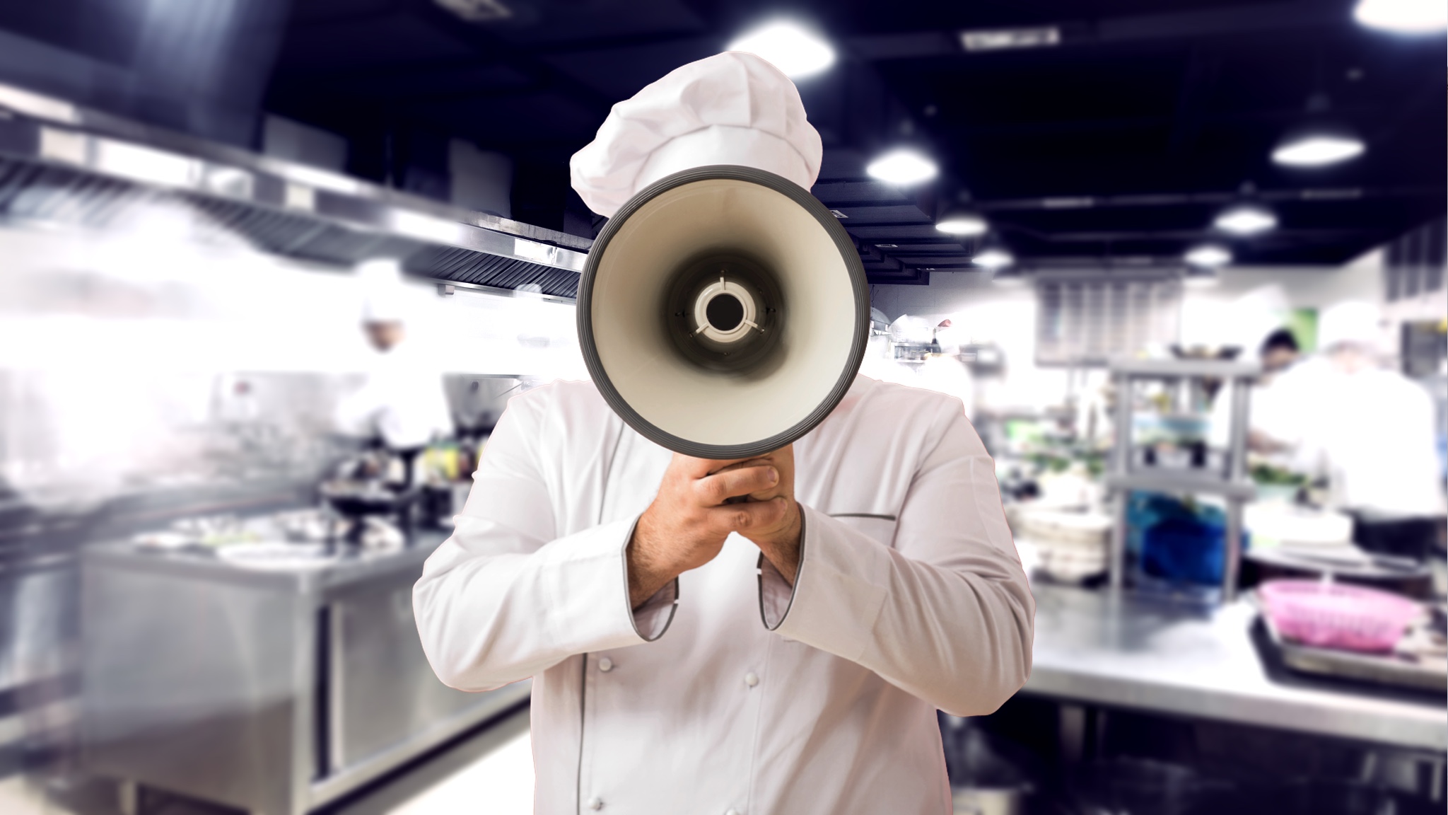 Yelling into bullhorn in restaurant kitchen